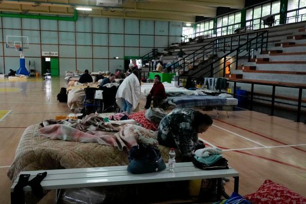 people-rest-in-a-makeshift-camp-set-up-inside-the-gymnasium-of-the-flooded-town-of-castel-bolognese-italy-thursday-may-18-2023-exceptional-rains-wednesday-in-a-drought-struck-region-of-northern-i