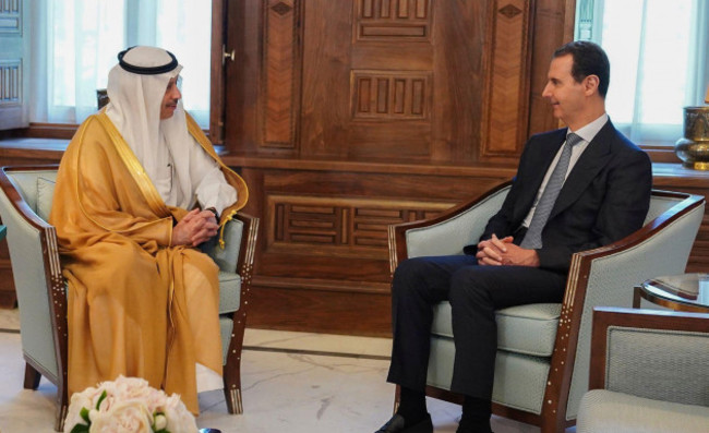 in-this-photo-released-by-the-official-facebook-page-of-the-syrian-presidency-syrian-president-bashar-assad-right-meets-with-saudi-arabia-ambassador-to-jordan-nayef-al-sadiri-in-damascus-syria-w