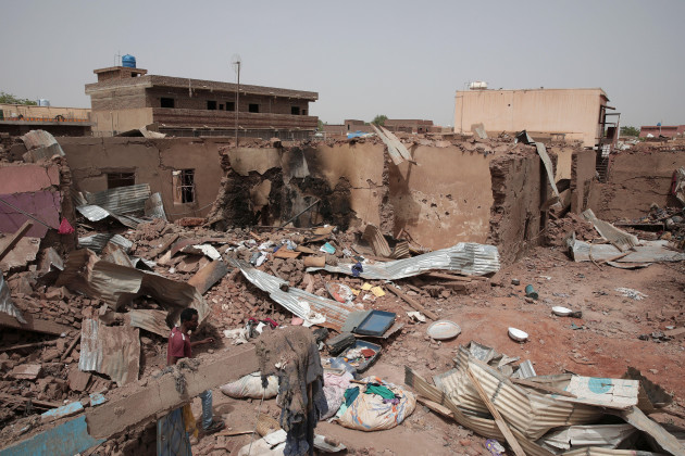 file-a-man-walks-by-a-house-hit-in-recent-fighting-in-khartoum-sudan-april-25-2023-the-u-s-conducted-its-first-organized-evacuation-of-citizens-and-permanent-residents-from-sudan-the-state-dep