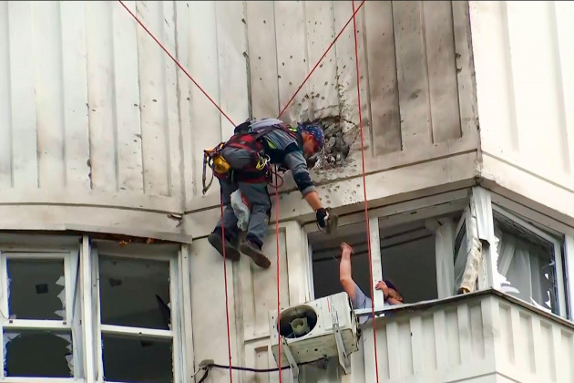 in-this-image-taken-from-video-investigators-inspect-the-building-after-a-ukrainian-drone-damaged-an-apartment-building-in-moscow-russia-tuesday-may-30-2023-in-moscow-residents-reported-hearing