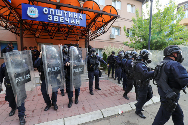 kosovo-police-officers-guard-a-municipal-building-in-the-town-of-zvecan-northern-kosovo-monday-may-29-2023-ethnic-serbs-in-northern-kosovo-on-monday-tried-to-take-over-the-local-government-buildi