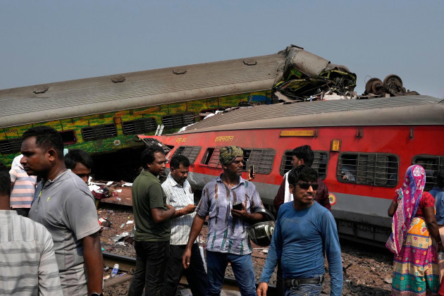 people-inspect-the-site-of-passenger-trains-that-derailed-in-balasore-district-in-the-eastern-indian-state-of-orissa-saturday-june-3-2023-rescuers-are-wading-through-piles-of-debris-and-wreckage
