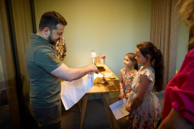 kiev-ukraine-31st-may-2023-ukrainian-president-volodymyr-zelenskyy-left-is-presented-with-drawings-by-children-at-the-opening-of-the-center-for-the-protection-of-childrens-rights-may-31-2023