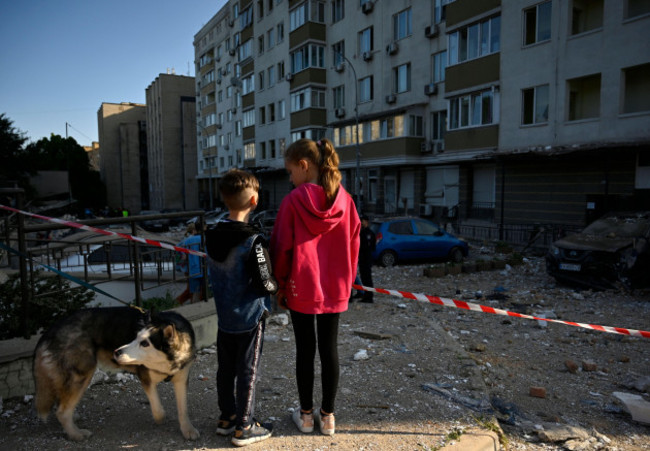 kyiv-ukraine-30th-may-2023-children-look-at-their-multi-storey-residential-building-damaged-by-shrapnels-from-a-downed-kamikaze-drone-of-the-russian-army-russia-attacked-the-ukrainian-capital-wit