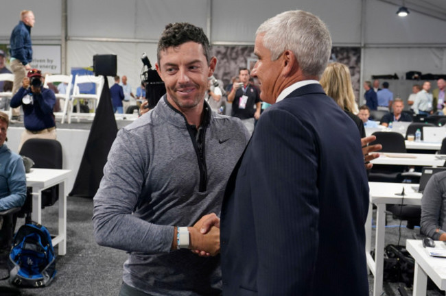 rory-mcilroy-of-northern-ireland-left-shakes-hands-with-pga-tour-commissioner-jay-monahan-after-a-press-conference-at-east-lake-golf-club-prior-to-the-start-of-the-tour-championship-golf-tournament