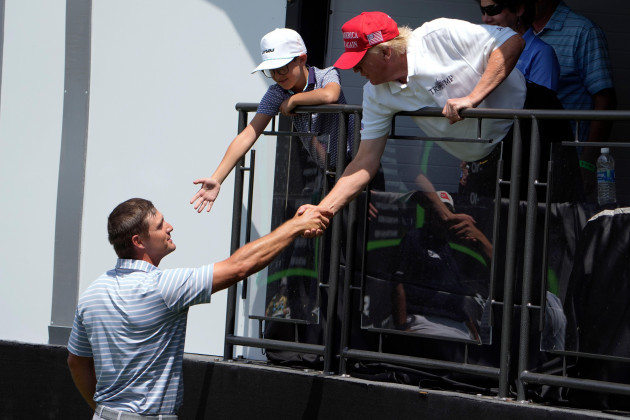 professional-golfer-bryson-dechambeau-shakes-hands-with-former-president-donald-trump-during-the-second-round-of-the-liv-golf-at-trump-national-golf-club-saturday-may-27-2023-in-sterling-va-ap