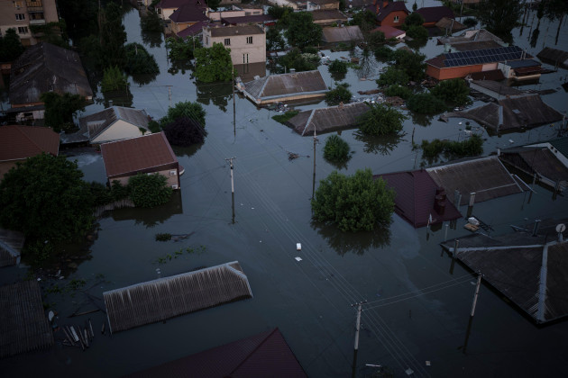 homes-are-seen-underwater-in-a-flooded-neighborhood-in-kherson-ukraine-wednesday-june-7-2023-floodwaters-from-a-collapsed-dam-kept-rising-in-southern-ukraine-on-wednesday-forcing-hundreds-of-peo