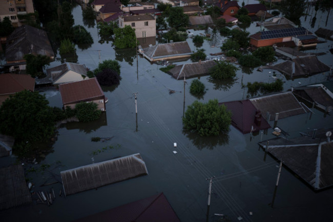 homes-are-seen-underwater-in-a-flooded-neighborhood-in-kherson-ukraine-wednesday-june-7-2023-floodwaters-from-a-collapsed-dam-kept-rising-in-southern-ukraine-on-wednesday-forcing-hundreds-of-peo