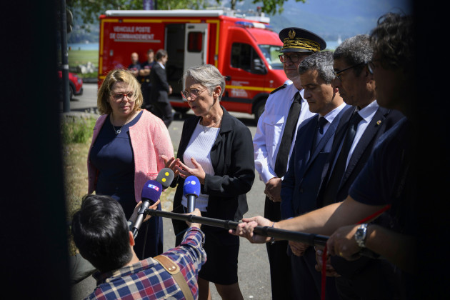 french-prime-minister-elisabeth-borne-second-left-gestures-as-she-addresses-the-media-in-annecy-french-alps-thursday-june-8-2023-an-attacker-with-a-knife-stabbed-several-young-children-and-at-l