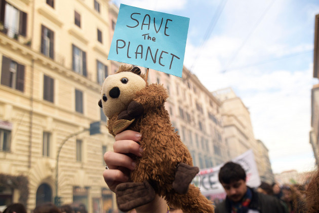rome-italy-03-march-2023-a-stuffed-animal-holding-a-sign-that-reads-save-the-planet-is-seen-during-the-demonstration-climate-activists-held-a-demonstration-organized-by-fridays-for-future-as-p