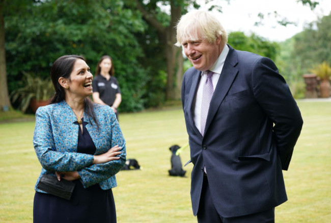 prime-minister-boris-johnson-and-home-secretary-priti-patel-during-a-visit-to-surrey-police-headquarters-in-guildford-surrey-to-coincide-with-the-publication-of-the-governments-beating-crime-plan