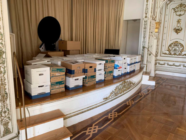 this-image-contained-in-the-indictment-against-former-president-donald-trump-shows-boxes-of-records-being-stored-on-the-stage-in-the-white-and-gold-ballroom-at-trumps-mar-a-lago-estate-in-palm-beac