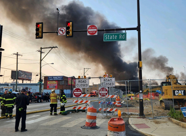this-image-provided-by-the-philadelphia-fire-department-shows-officials-working-on-the-scene-following-a-collapse-on-i-95-after-a-truck-fire-sunday-june-11-2023-in-philadelphia-the-elevated-secti