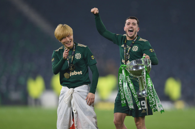glasgow-scotland-19th-december-2021-two-goal-hero-kyogo-furuhashi-of-celtic-with-mikey-johnston-of-celtic-with-the-premier-sports-cup-after-the-premier-sports-cup-match-at-hampden-park-glasgow-pi