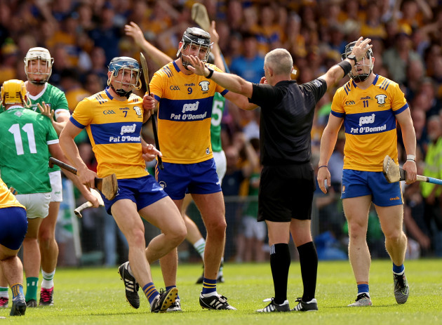 david-mcinerney-cathal-malone-and-tony-kelly-speak-with-referee-liam-gordon-at-the-final-whistle