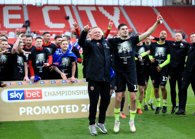 sheffield-uniteds-manager-chris-wilder-celebrates-with-team-mate-john-egan-after-his-sides-promotion-to-the-premier-league