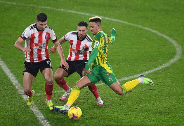 sheffield-uniteds-john-egan-george-baldock-and-west-bromwich-albions-callum-robinson-battle-for-the-ball-during-the-premier-league-match-at-bramall-lane-sheffield-picture-date-tuesday-february-2