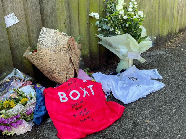football-shirts-beside-floral-tributes-by-his-sons-lee-and-james-at-the-scene-on-magdala-road-nottingham-where-65-year-old-school-caretaker-ian-coates-was-stabbed-to-death-three-people-were-killed