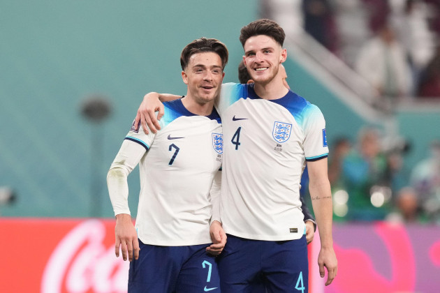 englands-jack-grealish-left-celebrates-with-team-mate-declan-rice-following-the-fifa-world-cup-group-b-match-at-the-khalifa-international-stadium-doha-picture-date-monday-november-21-2022