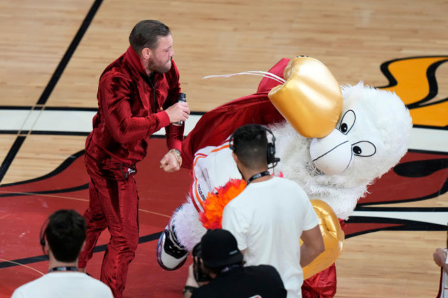 mma-fighter-conor-mcgregor-takes-a-swing-at-burnie-the-miami-heat-mascot-during-a-break-in-game-4-of-the-basketball-nba-finals-against-the-denver-nuggets-friday-june-9-2023-in-miami-ap-photol