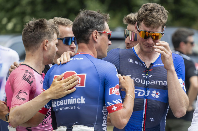 from-left-stefan-bissegger-from-switzerland-of-ef-education-easy-post-silvan-dillier-from-switzerland-of-alpecin-deceuninck-and-stefan-kueng-from-switzerland-of-groupama-fdj-mourn-their-dead-collea