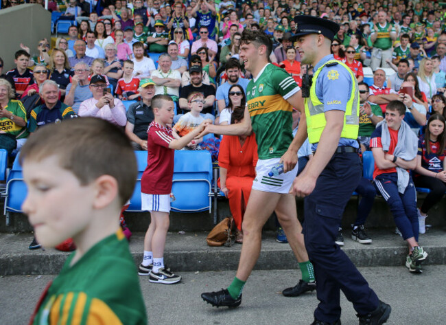 david-clifford-receives-an-escort-from-the-stands-before-the-final-whistle