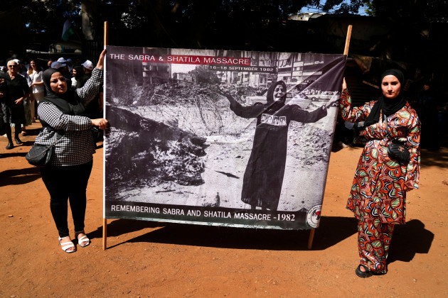 palestinian-activists-hold-a-banner-to-commemorate-the-40th-anniversary-of-the-sabra-and-shatila-massacre-at-the-mass-grave-where-the-massacres-victims-buried-in-beirut-lebanon-friday-sept-16