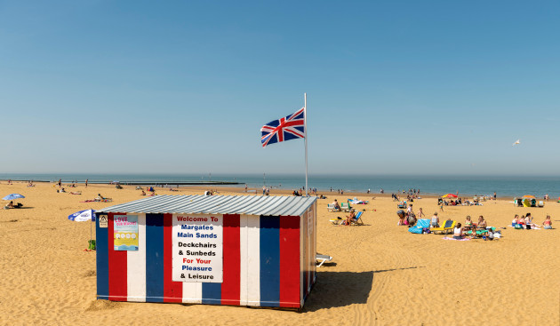 margate-beach-from-the-promenade-with-the-deckchair-hut-in-the-foreground-flying-the-union-jack
