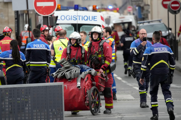 police-officers-and-rescue-workers-work-at-the-site-of-a-fire-wednesday-june-21-2023-in-paris-a-strong-explosion-hit-a-building-in-paris-left-bank-on-wednesday-leaving-four-people-injured-and-ign