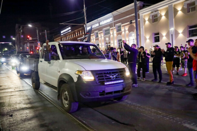 local-people-applaud-servicemen-of-the-wagner-group-military-company-as-they-prepare-to-leave-an-area-of-the-headquarters-of-the-southern-military-district-on-a-street-in-rostov-on-don-russia-saturd