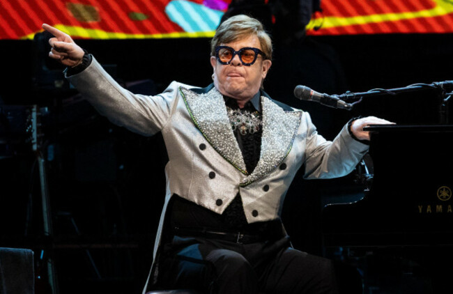 munich-germany-27th-apr-2023-singer-and-pianist-elton-john-sits-on-stage-at-the-olympiahalle-during-a-concert-as-part-of-his-farewell-yellow-brick-road-tour-2023-credit-sven-hoppedpa-attent