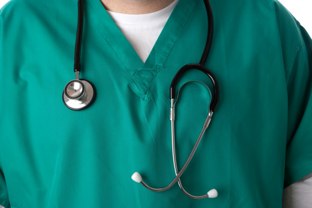 man-junior-doctor-or-nurse-wearing-green-medical-scrubs-and-stethoscope