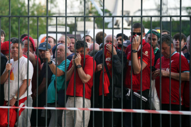 file-photo-dated-28-05-2022-of-liverpool-fans-cover-their-mouths-and-noses-as-they-queue-to-gain-entry-to-the-stadium-as-kick-off-is-delayed-ahead-of-the-uefa-champions-league-final-at-the-stade-de-fr