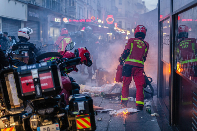 paris-france-30th-june-2023-firefighters-seen-putting-out-a-fire-during-the-spontaneous-demonstration-on-the-fourth-day-of-protests-following-the-death-of-17-year-old-nahel-by-police-in-nanterre