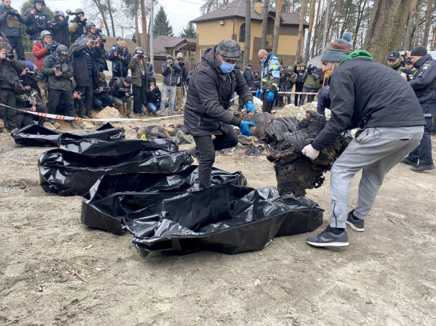 bucha-ukraine-april-5-2022-law-enforcers-put-the-bodies-of-civilians-killed-by-russian-occupiers-who-attempted-to-burn-them-to-hide-their-crimes