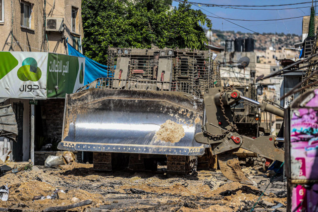 jenin-palestine-03rd-july-2023-an-israeli-military-bulldozer-seen-leveling-roads-and-destroying-the-center-of-the-jenin-refugee-camp-during-a-raid-on-the-camp-near-the-city-of-jenin-north-of-the