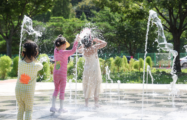 01st-july-2023-avoiding-heat-wave-children-play-in-a-fountain-at-a-square-in-the-southeastern-city-of-daegu-on-july-1-2023-amid-a-heat-wave-the-government-issued-heat-wave-advisories-for-most-reg