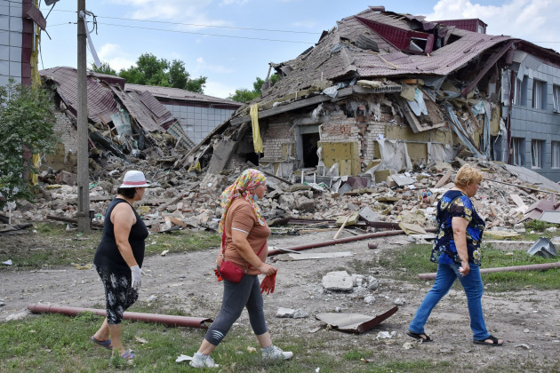 july-2-2023-komyshevakha-zaporizhzhia-ukraine-local-resident-walking-by-the-high-school-that-was-heavily-damaged-in-the-night-following-russian-shelling-in-komyshevakha-ukraines-long-anticipat