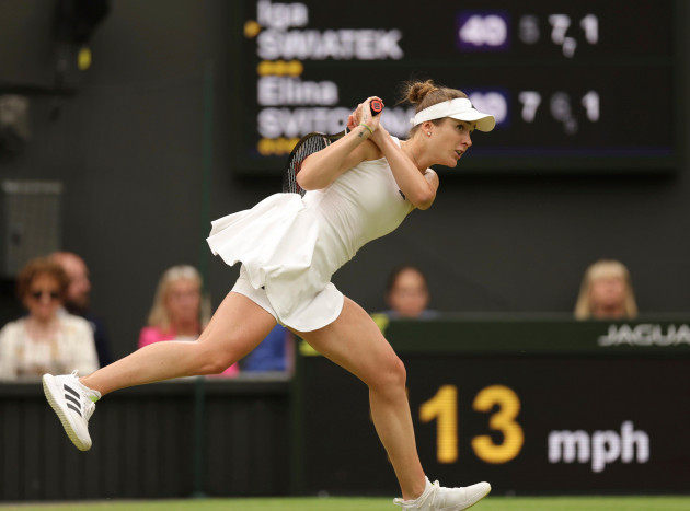 elina-svitolina-of-ukraine-hits-a-ball-during-the-ladies-singles-quarter-finals-match-against-iga-swiatek-of-poland-in-the-championships-wimbledon-at-all-england-lawn-tennis-and-croquet-club-in-lond