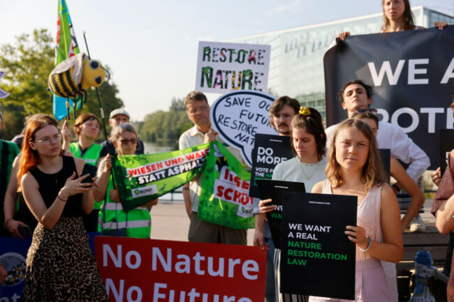 swedish-climate-activist-greta-thunberg-right-and-other-activists-attend-a-demonstration-outside-the-european-parliament-tuesday-july-11-2023-in-strasbourg-eastern-france-protesters-and-legisla