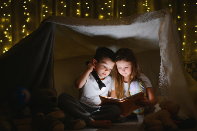 readingandfamilygamesinchildrenstent-boyandgirl