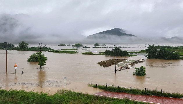 a-part-of-a-park-along-the-geum-river-are-flooded-due-to-heavy-rain-in-sejong-south-korea-saturday-july-15-2023-two-days-of-heavy-rain-in-south-korea-killed-several-people-and-left-a-few-others-m