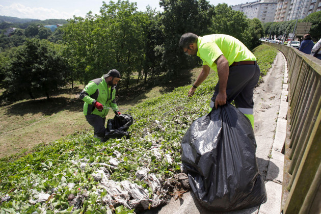 workers-clean-debris-from-the-sewers-in-parque-das-fontinas-on-june-5-2023-in-lugo-galicia-spain-the-city-of-lugo-is-recovering-after-the-rain-and-hail-storm-of-yesterday-sunday-june-4-which