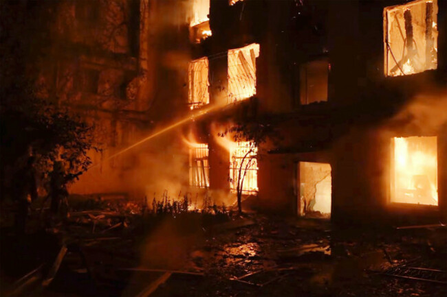 in-this-image-taken-from-video-provided-by-the-ukrainian-emergency-service-emergency-services-work-at-a-scene-of-destroyed-residential-area-after-a-russian-attack-in-mykolaiv-ukraine-thursday-july