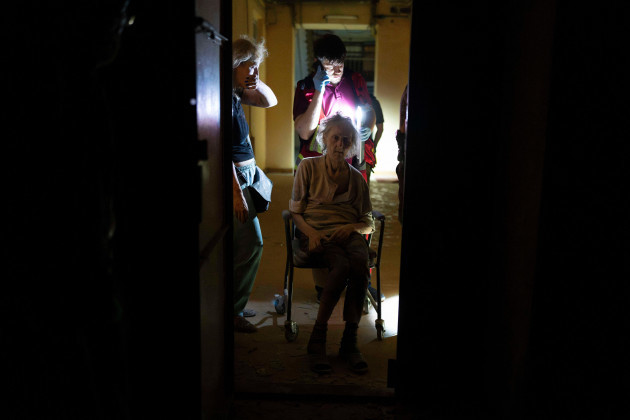 an-elderly-woman-waits-for-medical-help-at-an-apartment-building-heavily-damaged-in-russian-missile-attacks-in-odesa-ukraine-sunday-july-23-2023-ap-photojae-c-hong