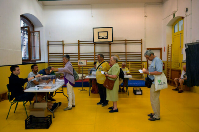 a-woman-casts-her-ballot-at-a-polling-station-to-vote-in-general-elections-in-pamplona-spain-sunday-july-23-2023-voters-in-spain-go-to-the-polls-sunday-in-an-election-that-could-make-the-country-t