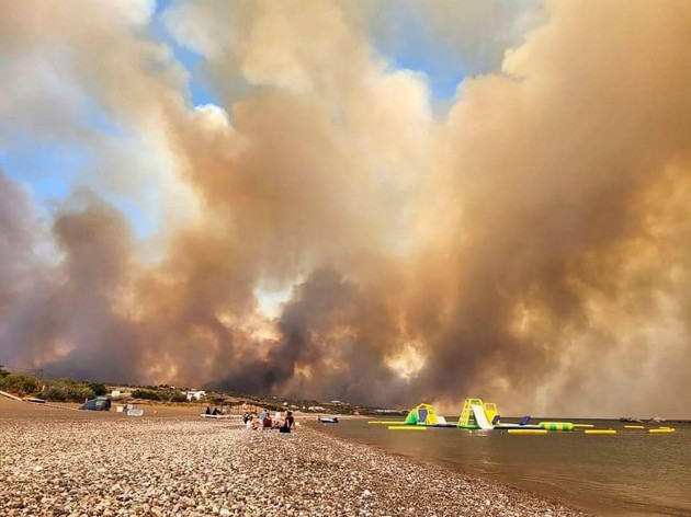 clouds-of-smoke-from-a-forest-fire-rise-to-the-sky-on-the-island-of-rhodes-greece-saturday-july-22-2023-a-large-blaze-burning-on-the-greek-island-of-rhodes-for-the-fifth-day-has-forced-authoritie