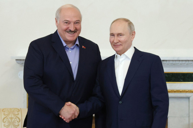 russian-president-vladimir-putin-right-and-belarusian-president-alexander-lukashenko-left-shake-hands-during-a-meeting-in-st-petersburg-russia-sunday-july-23-2023-alexander-demianchuk-sput
