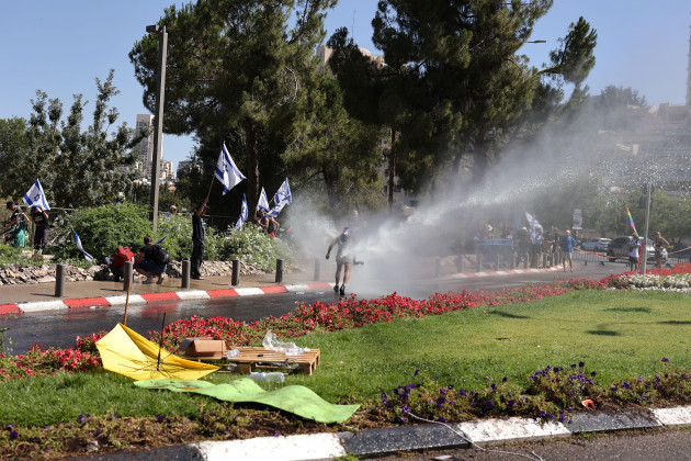 jerusalem-israel-24th-july-2023-israeli-police-use-water-cannon-to-disperse-demonstrators-blocking-the-road-leading-to-the-knesset-as-israels-parliament-was-expected-to-take-a-final-vote-on-a-ke