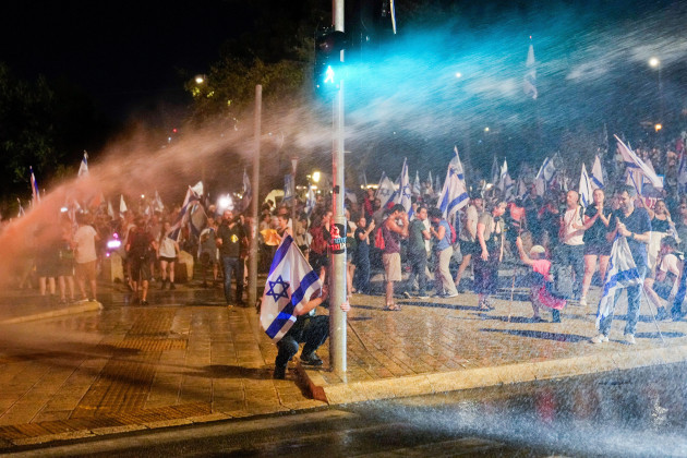 israeli-police-use-a-water-cannon-to-disperse-demonstrators-blocking-a-road-during-a-protest-against-plans-by-prime-minister-benjamin-netanyahus-government-to-overhaul-the-judicial-system-in-jerusal